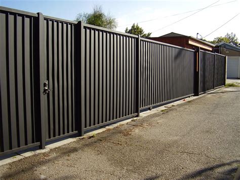 house with black metal fence|black metal fence ideas.